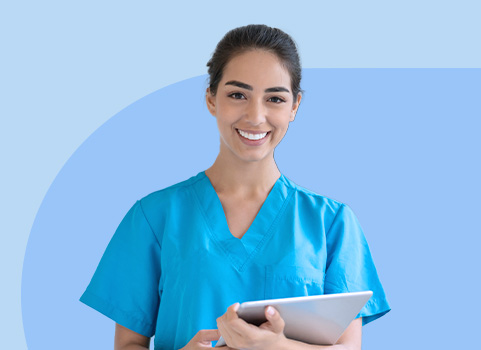 Medical assistant in blue scrubs on blue background.