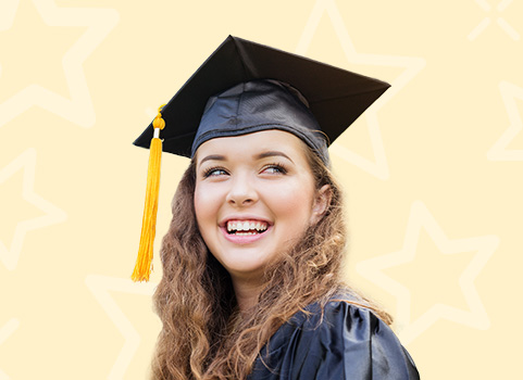 Girl in black cap and gown with yellow tassel smiling on orange background.