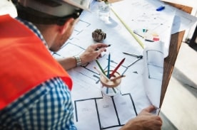 Architect reviewing floor plans