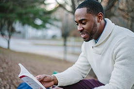 Man studying outside.
