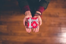 person holding small present