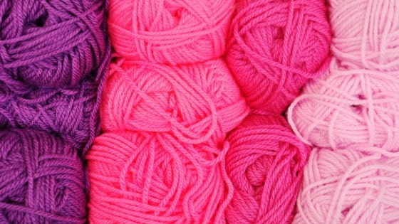 close up photo of different colored yarns