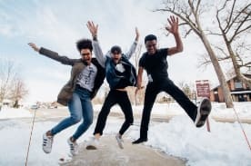 three friends jumping