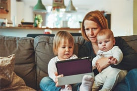 Mother studying with children