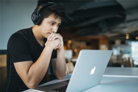 Student looking at a computer