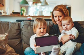 mother with kids laptop