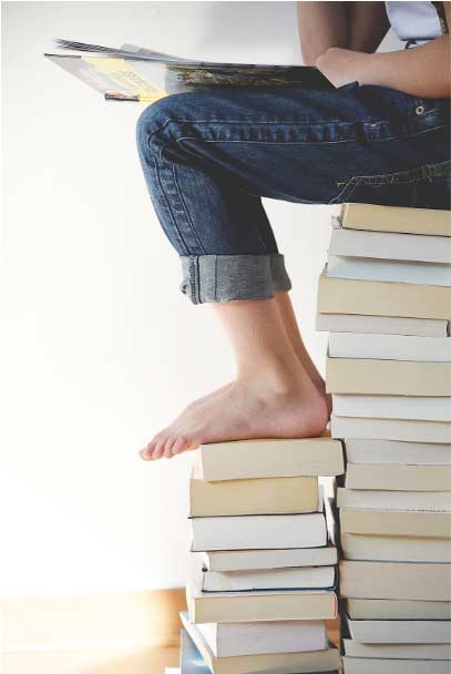 sitting on books