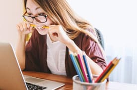 girl studying on laptop