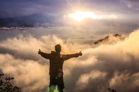 Man on top of mountain