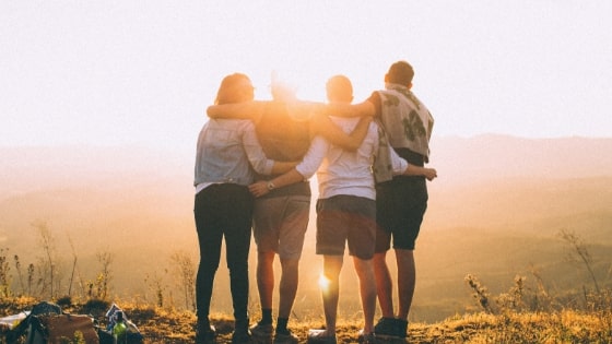 4 friends watching the sunset together