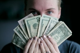 woman holding paper money