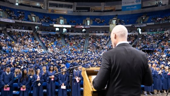Mark Slayton addressing Penn Foster graduates.