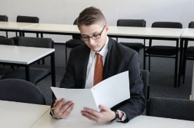 man looking at resume