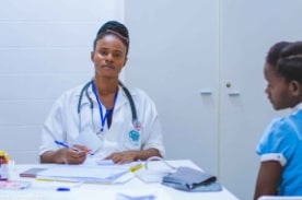 medical assistant taking patient vitals.