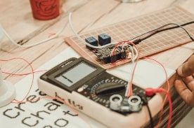 electronics and wires on table.