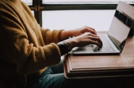 woman using laptop computer.