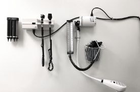 medical equipment on a white wall.