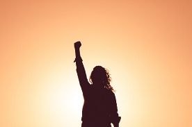 woman raising hand.