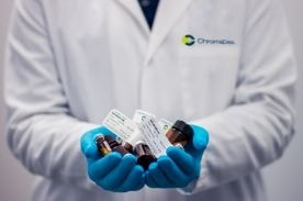 medical worker holding specimens for labwork.