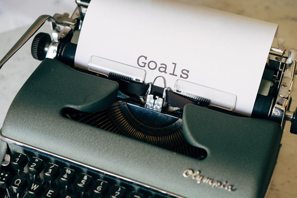 Typewriter with goals list.