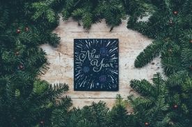 New Year drawing surrounded by green garland.
