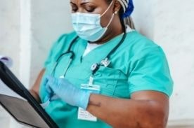 Healthcare manager with paperwork.