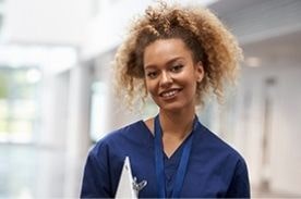 Medical assistant posing for camera.