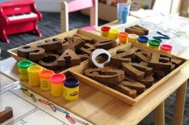 Wooden letters and Playdough.