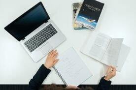 woman studying and taking notes.
