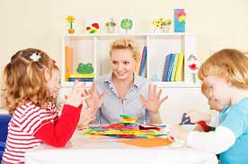 early childhood educator with students.
