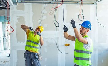 Two electricians at work.