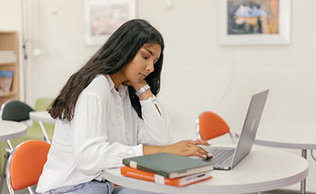 A high school student studying for a course.