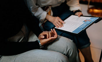 Two women reviewing a resume.