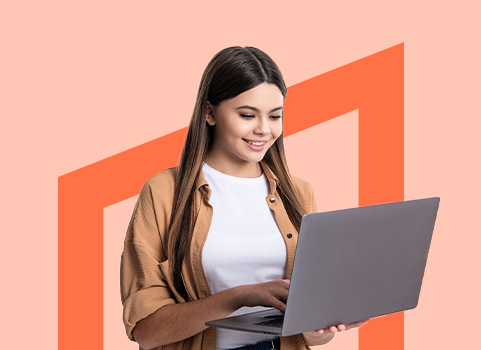 girl using silver laptop on orange background.