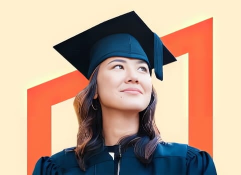 smiling woman wearing a cap and gown.
