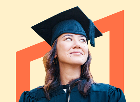 smiling woman wearing a cap and gown.