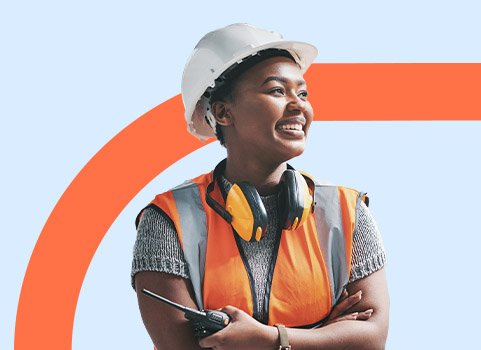 Woman wearing white hardhat and safety gear on orange and blue background.
