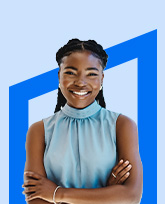 Young professional woman smiling with her arms crossed