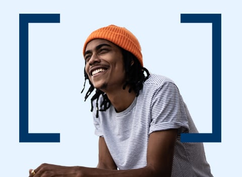 smiling man with an orange hat.