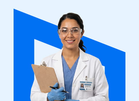 woman in blue scrubs and lab coat with latex gloves, clipboard, and safety glasses.