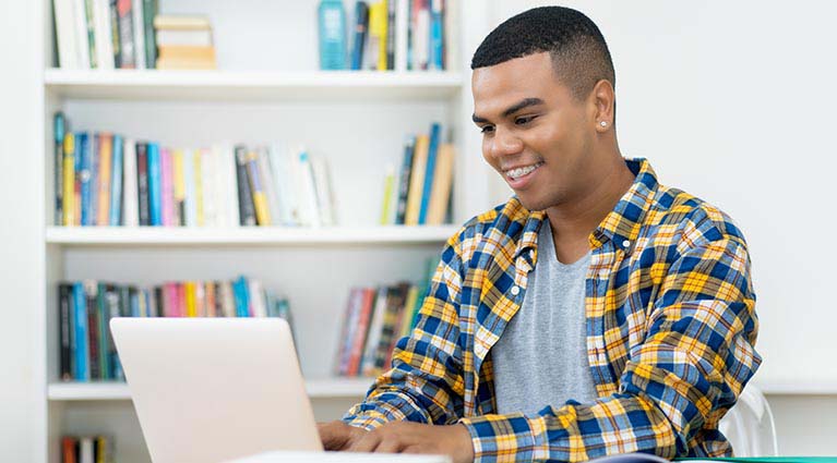 high school student on laptop.
