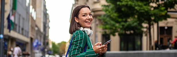 woman wearing headphones smiling
