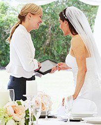 wedding planner talks to bride.