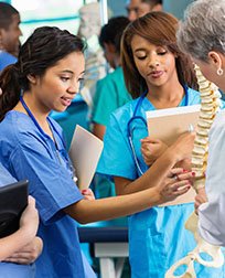 medical students and teacher in a lab.