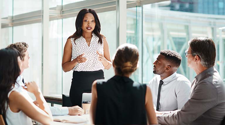 business woman speaks during meeting.