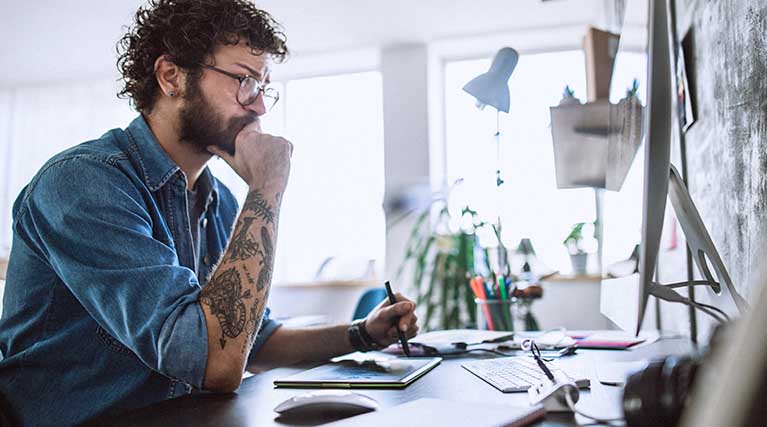 computer graphic artist working on computer.