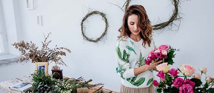 florist assembling bouquet.