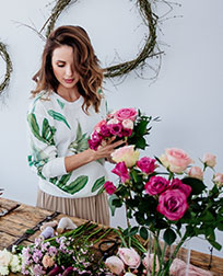 florist assembling bouquet.