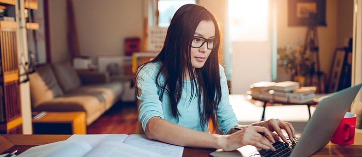 student studying on laptop.