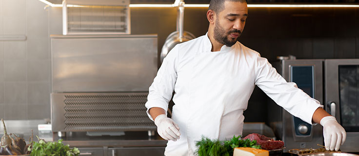 gourmet chef cooking in a kitchen.
